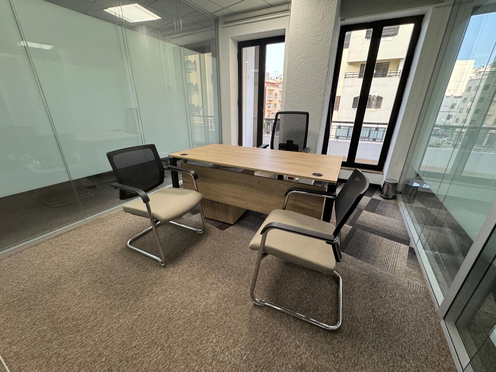 The Perch, a private, glass-walled CoZone office with city views